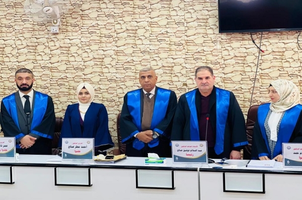 A faculty member from the University of Kirkuk participates in the discussion of a master&#039;s thesis at the University of Samarra.